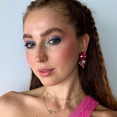 Woman with festival makeup look smiles easily