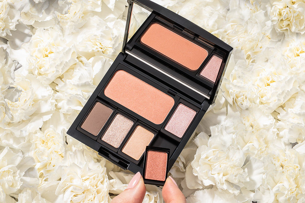 Several filled makeup palettes are shown