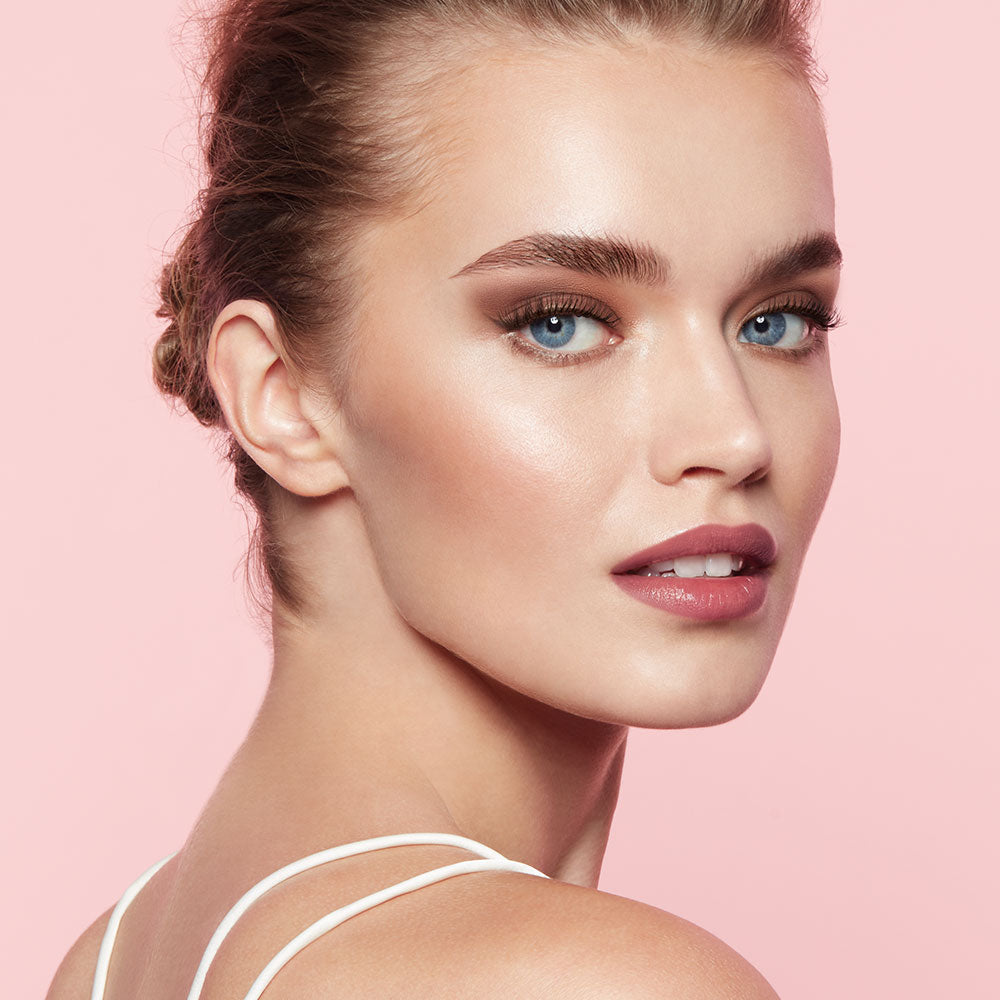 A woman is looking directly at the camera