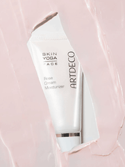 Rose Cream Moisturizer surrounded by the pink texture of the skincare product