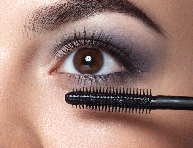 Mascara is applied to the upper and lower lashes.