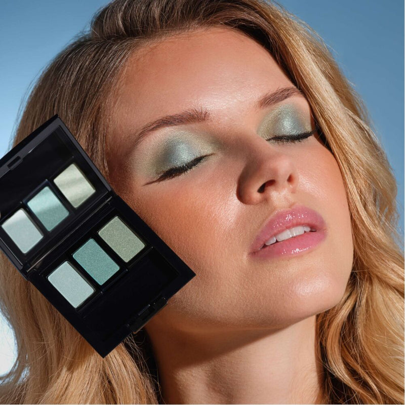 A woman with blonde hair is wearing eyeshadow that matches her hair color.