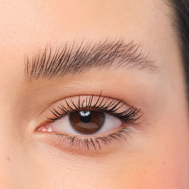Made-up face with laminated eyebrows.