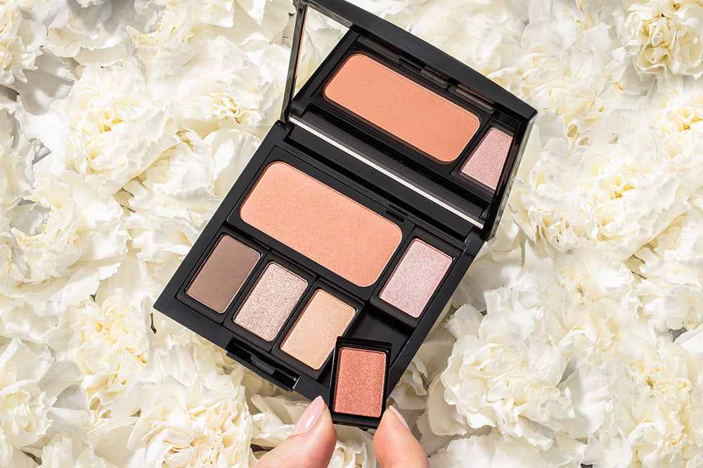 Several filled makeup palettes are shown