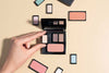 An empty make-up palette is filled with various eye shadows and blushers