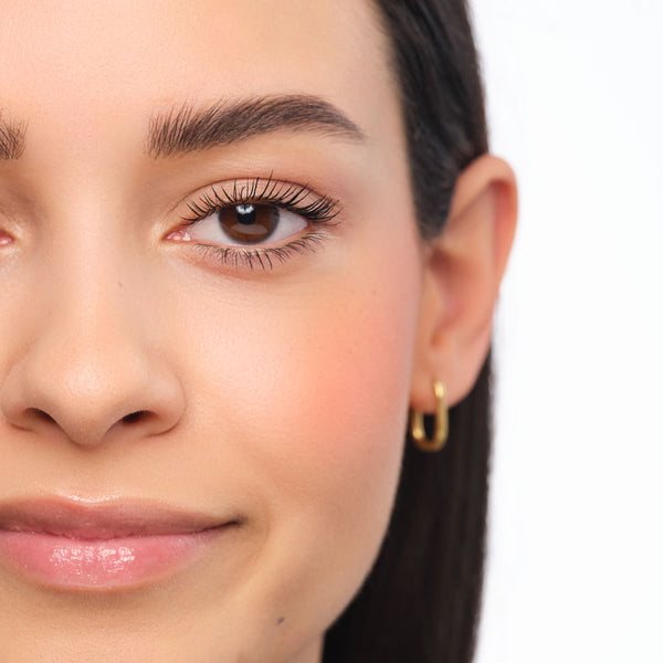 Final makeup look featuring brows styled in the Feather Brow technique.