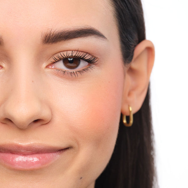 Made-up face with eyebrows with natural makeup.