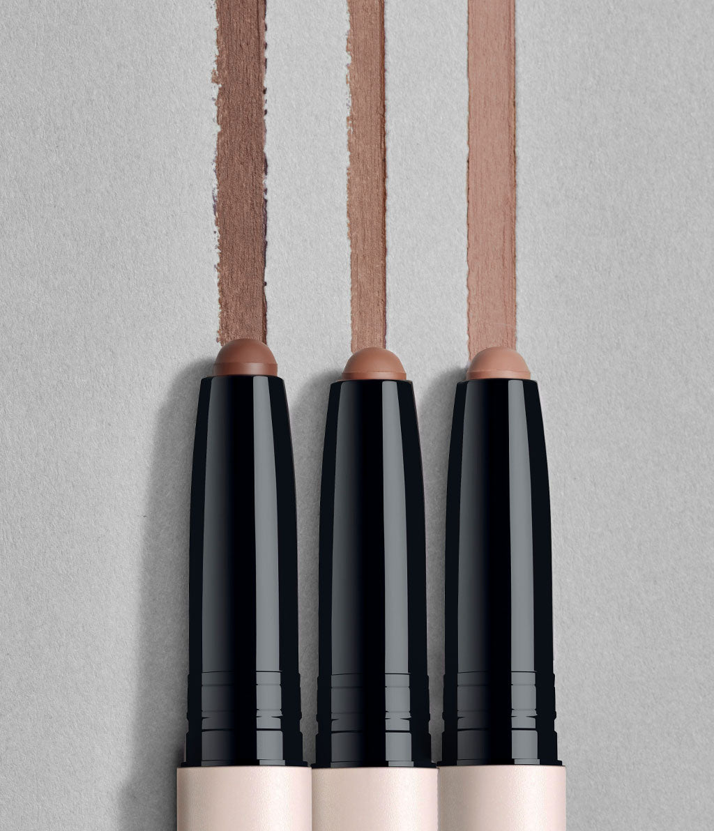 The three Contouring Micro Sticks are set against a gray background. Each stick is accompanied by its corresponding texture swatch.