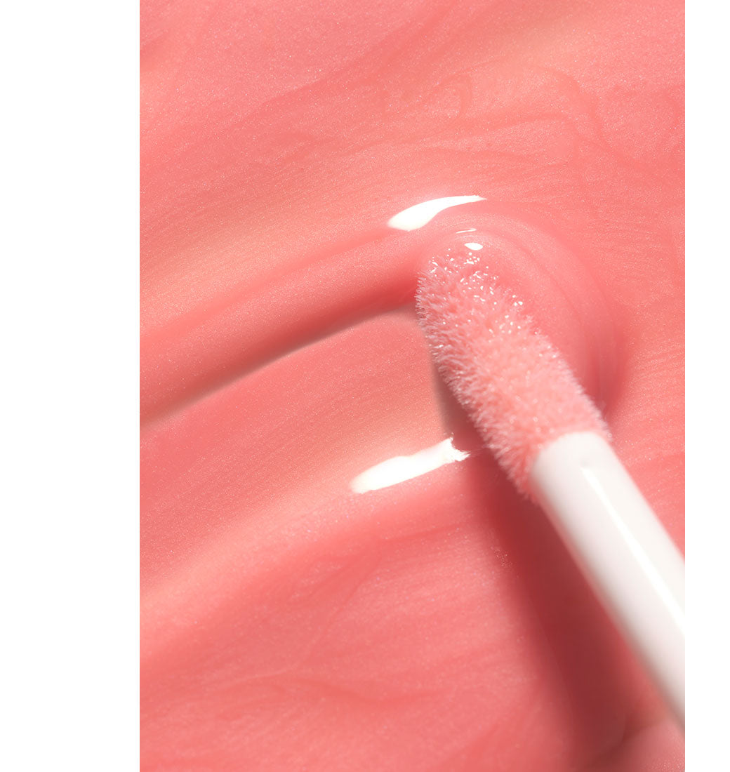 Aesthetic texture swatch of the new Lip Wonder Serum in peach.