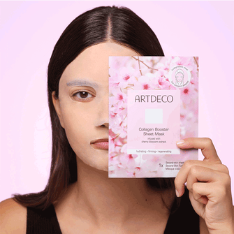 Collagen Boosting Sheet Mask is applied to the face of the model, who poses with the packaging