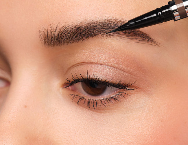 Sparse areas are filled in using the 24h Micro Brow Liquid Liner.