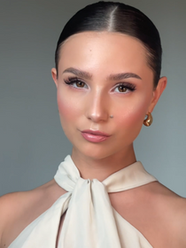 Made-up model with a wedding guest look.