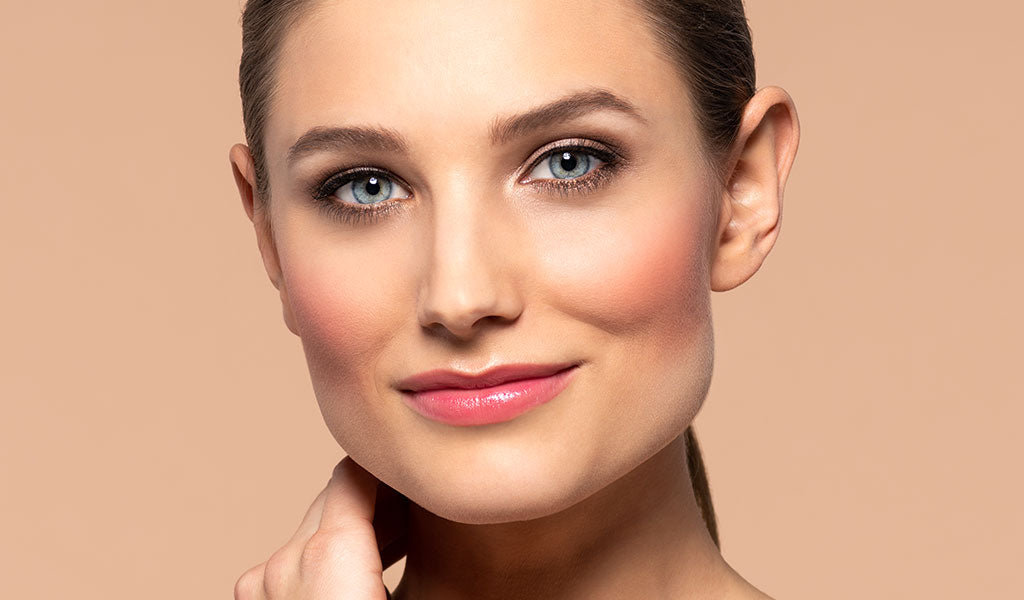 Woman with peach blush on cheeks for a fresh look