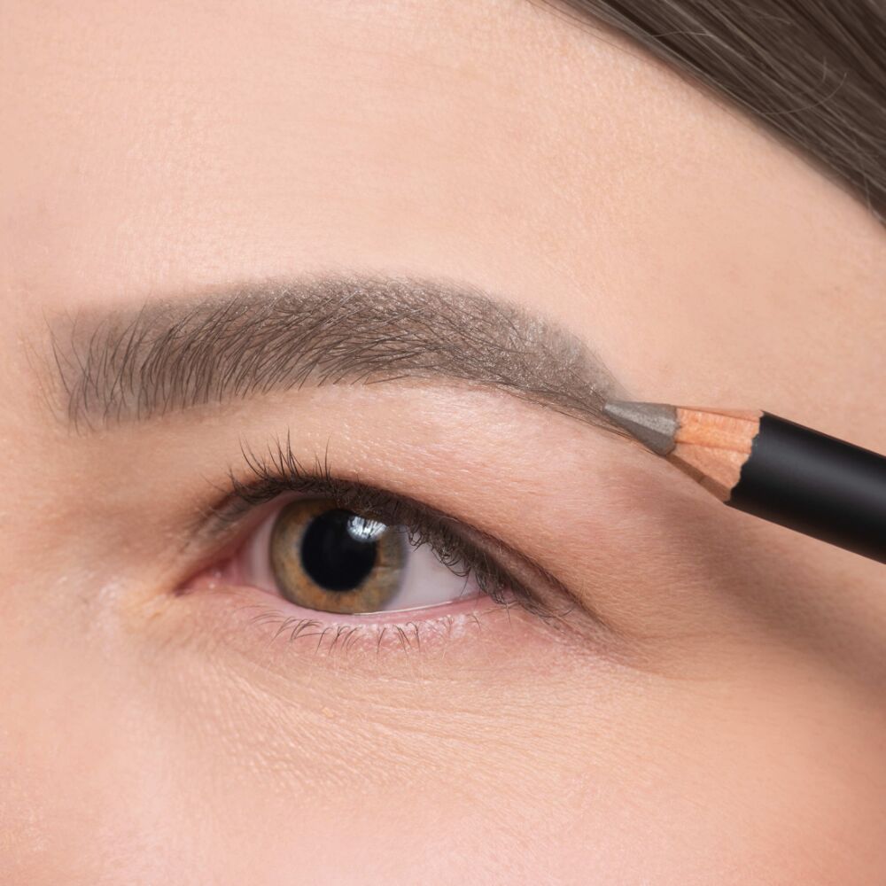 Light gray eyebrows drawn with Eye Brow Pencil in No. 6.